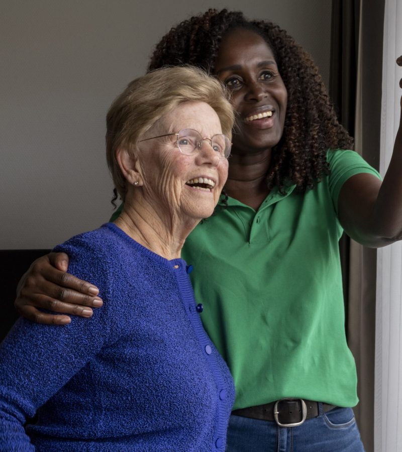 Helper caring for elderly lady